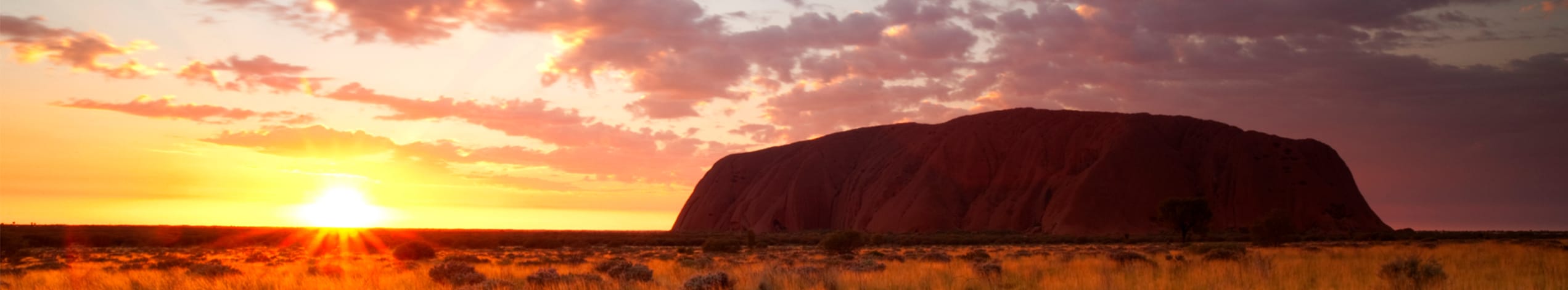 Solnedgång över Uluru och Kata Tjuta